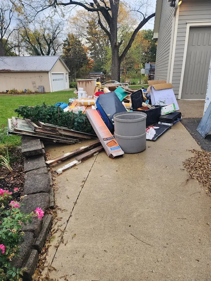 Dumpster being loaded with debris for 30 Yard Dumpster Rental in Grandview Heights